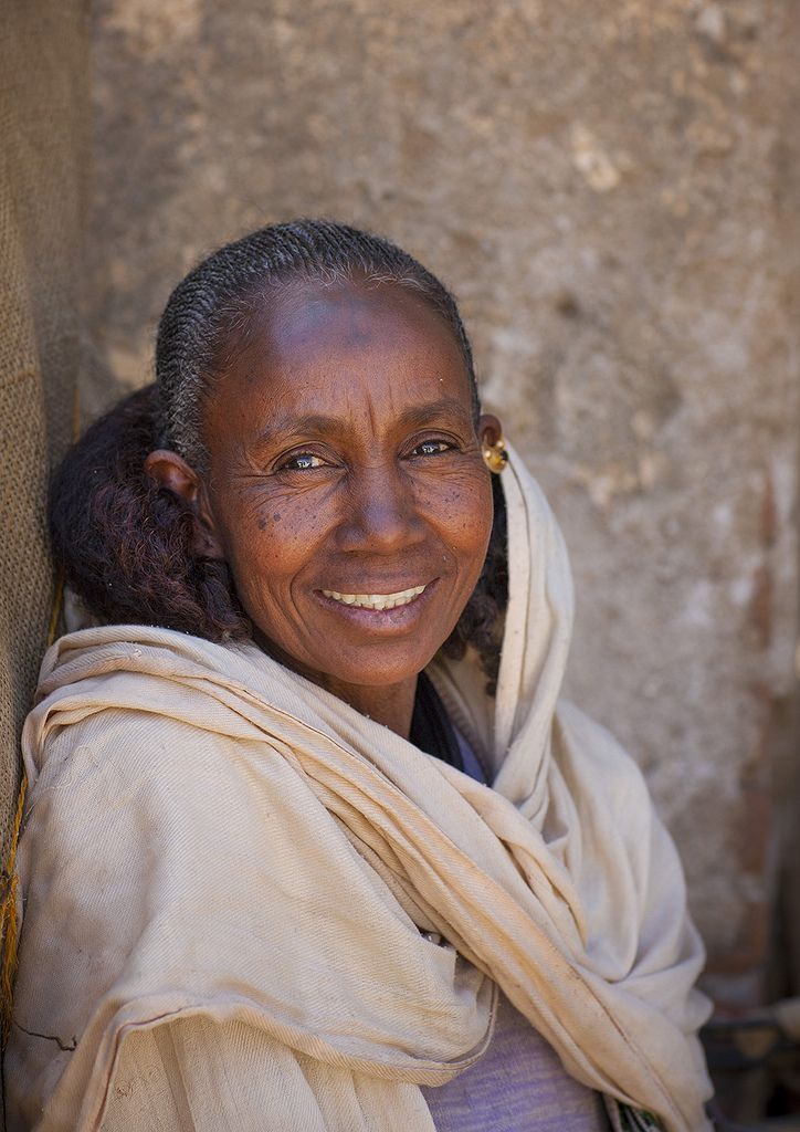 Elderly Eritrean woman smiling with white shawl